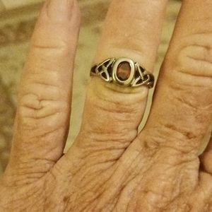 A amber colored stone ring
